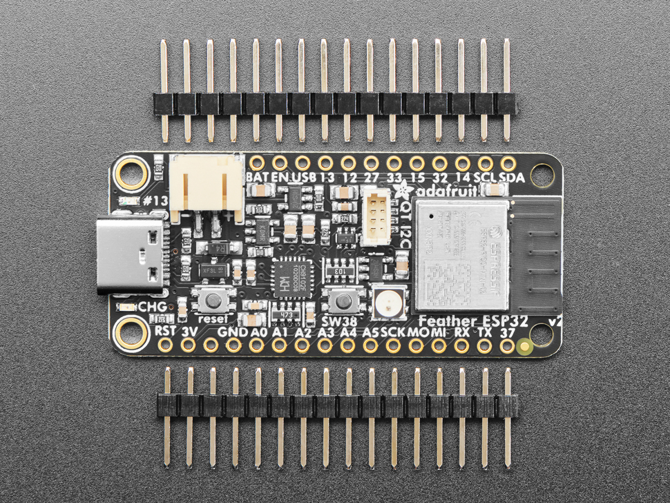 Top view of black rectangle-shaped microcontroller between two pieces of 16-pin 0.1" header.
