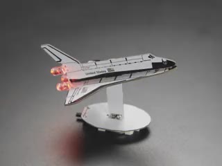 Rotational video of assembled space shuttle figurine.