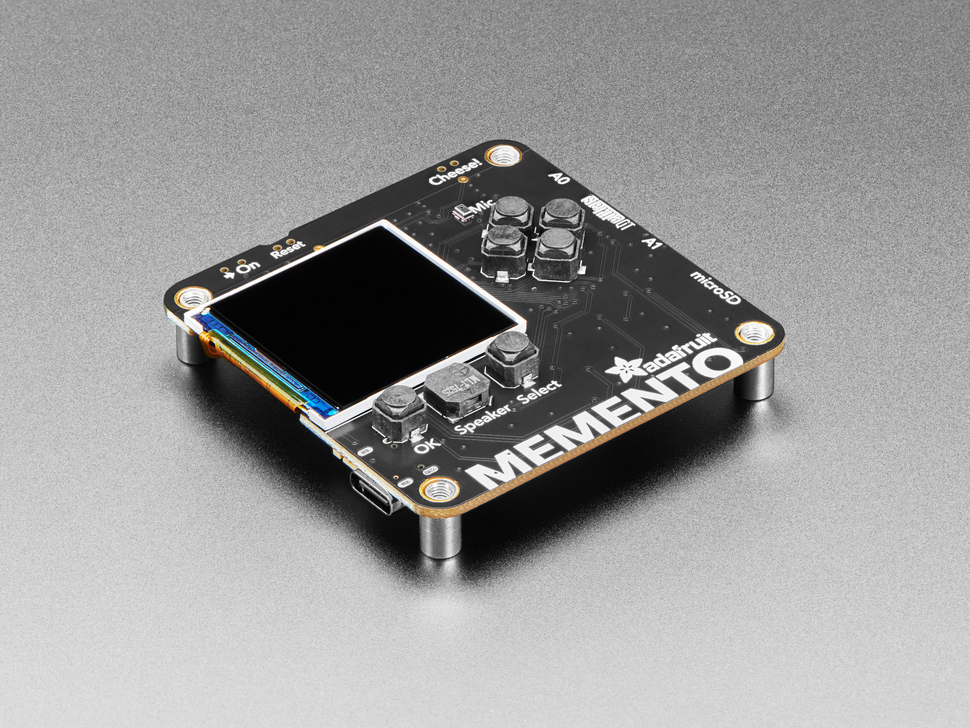 Angled shot of black, square-shaped camera board with TFT display and buttons.