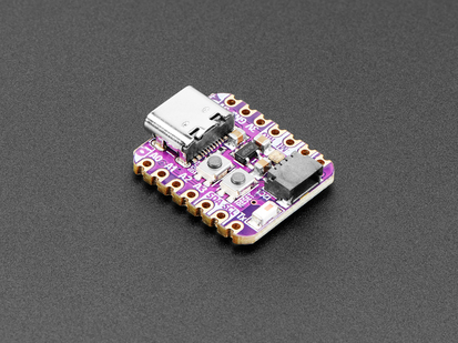 Angled shot of small purple microcontroller.