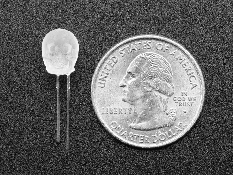 Single skull-shaped LED next to US quarter for scale.