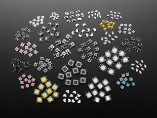Overhead shot of dozens of different sized and colored packs of tactile switches.