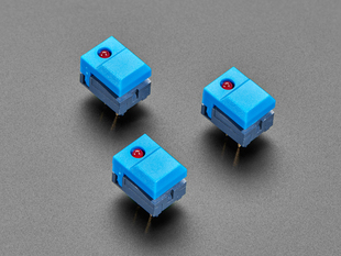 Angled shot of three blue step-switches with LEDs.