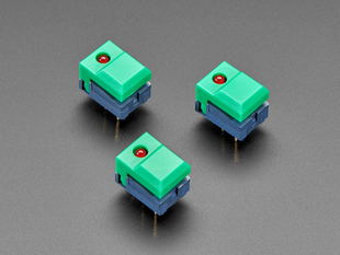 Angled shot of three green plastic step-switches with red LEDs.