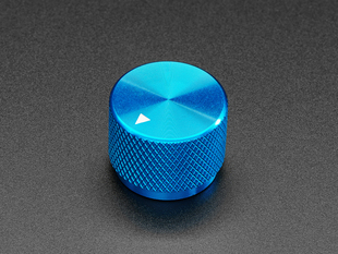 Angled shot of a blue aluminum knob. A white triangle on top of the knob points at 7:00. 