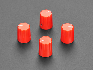 Angled shot of four red micro potentiometer knobs.