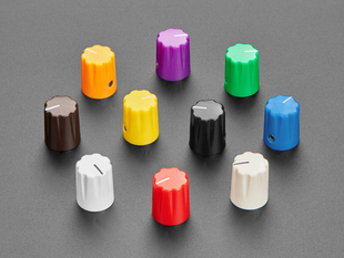 Angled shot of ten plastic micro potentiometer knobs in assorted colors.