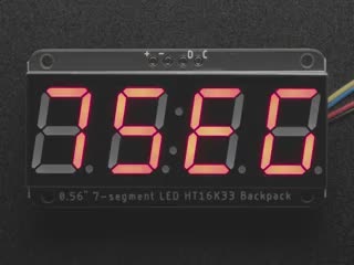 Red 7-segment clock display soldered to backpack with all segments lit