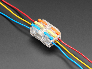Angled shot of PCT-2-3M wiring block with red, yellow, and blue wires.