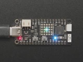 Overhead video of boot-up animation on 5x5 LED Matrix grid on rectangular microcontroller.