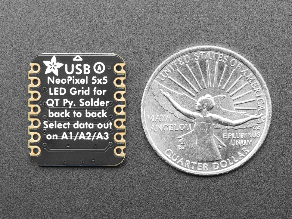 Back of small driver board next to US quarter for scale.