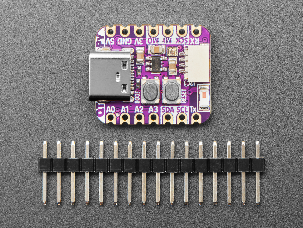 purple, square-shaped microcontroller above a piece of 16-pin header.