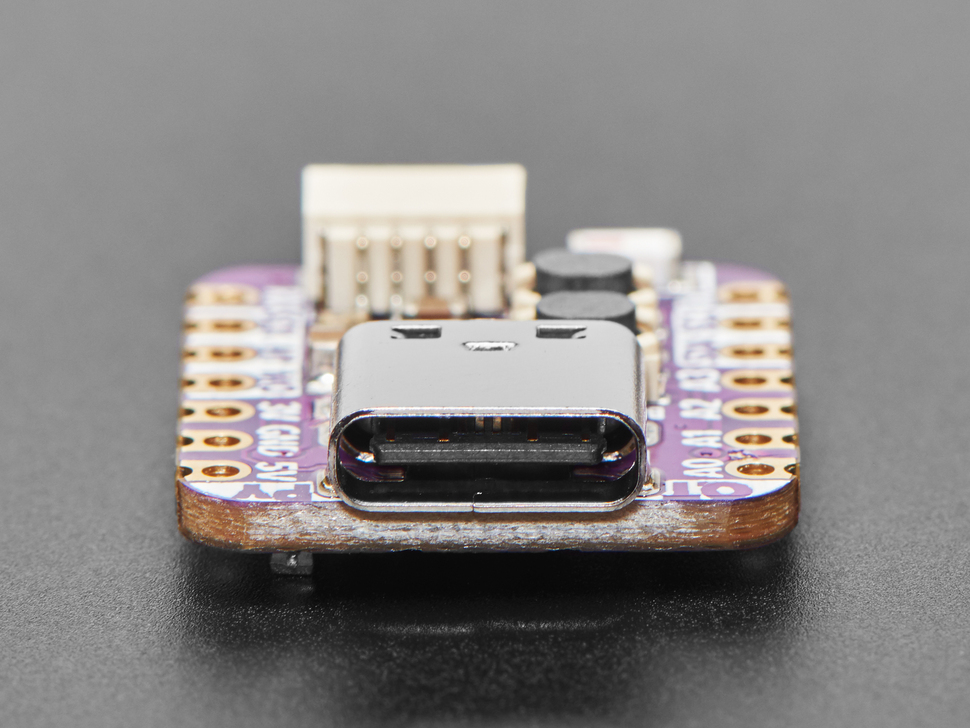 Close-up of USB Type-C connector on purple, square-shaped microcontroller.