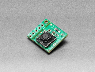 Angled shot of small green QR code reader sensor breakout.