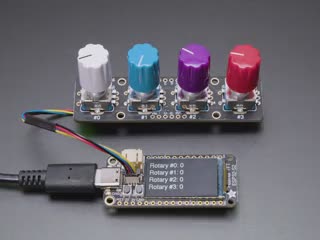 Video of a hand twisting the four encoder knobs with a data readout on a TFT microcontroller.