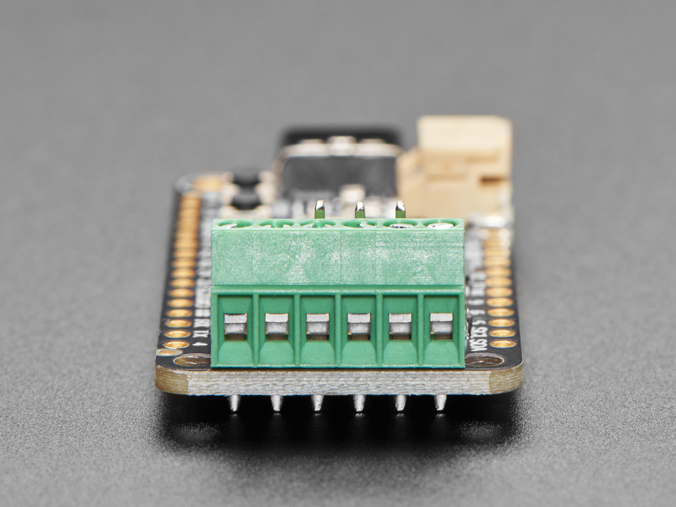 Close-up of terminal blocks on "Prop-Maker Feather" PCB .