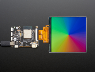 Overhead shot of No-Touch 4" 720x720 RGB666 TFT display, with Image of Rainbow Gradient on the screen.