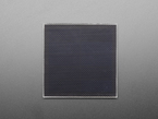 Overhead shot of medium-sized, black square solar panel.