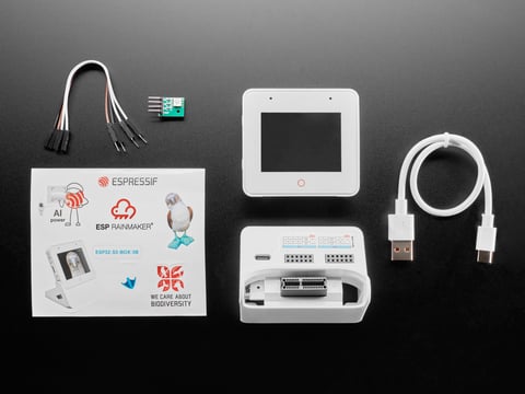 Overhead shot of electronics kit for white, square-shaped IoT display device.