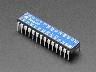 Adafruit AVR ATmegaXX8 Pinout Sticker displayed on a chip 