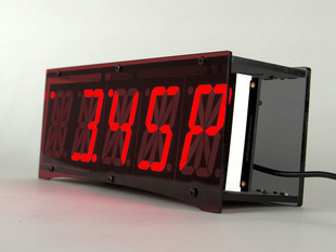 Angled shot of nightstand clock with large red digits
