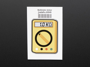 Rectangular sticker in the shape of yellow multimeter with dial, and a grey screen reading 1.0 kilohms. Mounted on white paper with barcode. 