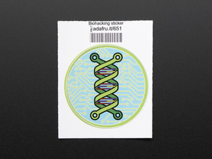 Circular sticker showing a green double helix over an abstracted blue and green circuitboard design. Badge is trimmed in green and mounted on white paper with barcode.  