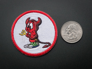 Circular embroidered badge with the BSD Daemon logo of a sad little red devil holding a pitchfork, over a white background, with red trim. Shown next to a quarter for scale. 