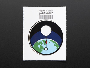 Circular sticker with white high altitude balloon over a green and blue earth on a black background, with black trim. Mounted on white paper with barcode. 