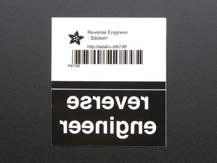 Black rectangular sticker with the backwards lettering REVERSE ENGINEER in white. Mounted on white paper with barcode