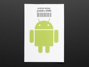 Circular sticker with Android's chartreuse robot logo on white background. Mounted on white paper with barcode