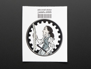 Circular sticker showing a cartoon of Ada Lovelace in profile, holding a crowbar and examining a long ruler, over a white background. Sticker is edged in black gear teeth. Mounted on white paper with barcode