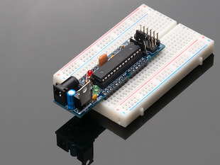 Angled shot of an assembled DC Boarduino (Arduino compatible) Kit on a white breadboard. 