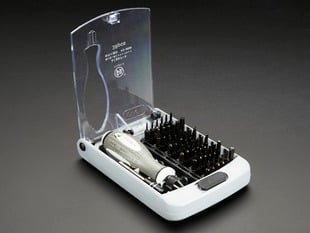 Open case of screwdriver kit with one handle and many tips