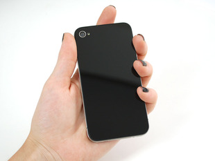 Hand holding up iphone with flat black back