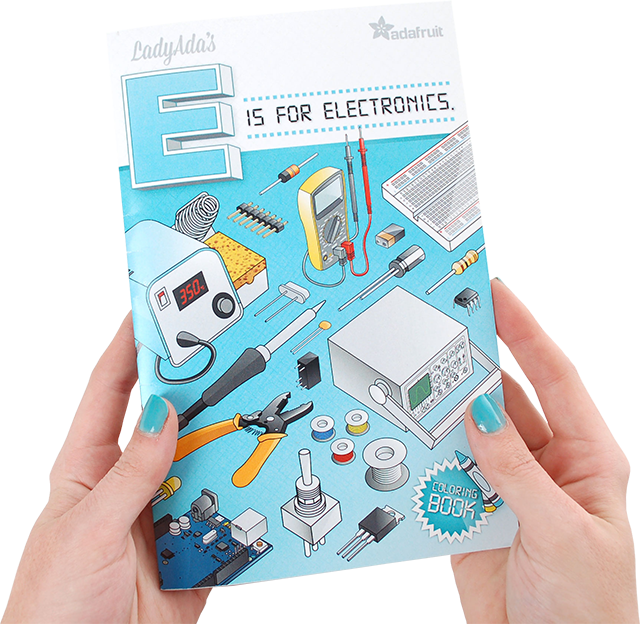 Two hands holding LadyAda's E is for Electronics Coloring Book by Adafruit